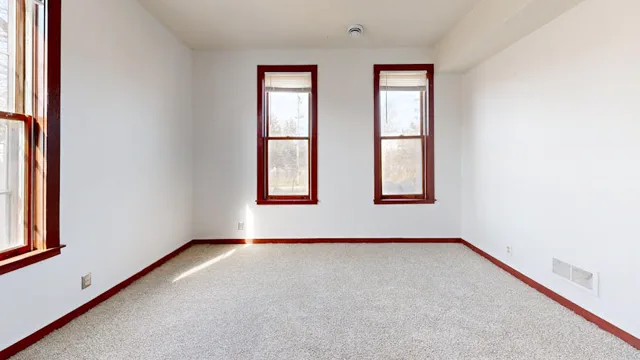Bright empty rental room ready for handover cleaning before inspection